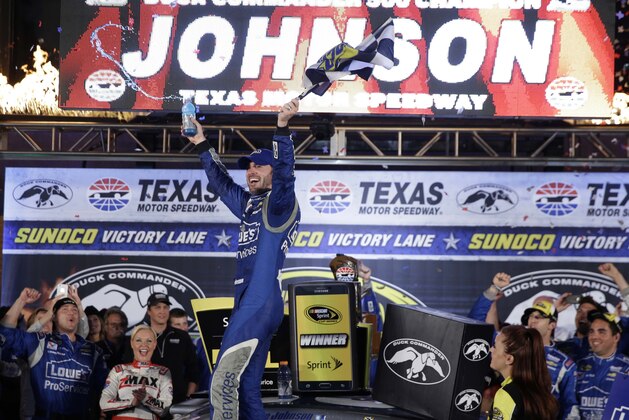 Jimmie Johnson celebrates winning the NASCAR Sprint Cup auto race at Texas Motor Speedway in Fort Worth, Texas, Saturday, April 11, 2015. (AP Photo/Tim Sharp) Jimmie Johnson celebrates winning the NASCAR Sprint Cup auto race at Texas Motor Speedway in Fort Worth, Texas, Saturday, April 11, 2015. (AP Photo/Tim Sharp)