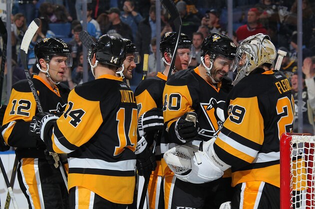 BUFFALO, NY - APRIL 11: The Pittsburgh Penguins celebrate their 2-0 victory over the Buffalo Sabres on April 11, 2015 at the First Niagara Center in Buffalo, New York.  (Photo by Bill Wippert/NHLI via Getty Images)