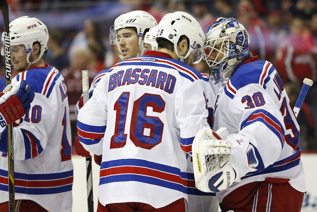 Apr 11, 2015; Washington, DC, USA; New York Rangers goalie Henrik Lundqvist (30) celebrates with teammates after their game against the Washington Capitals at Verizon Center. The Rangers won 4-2. Mandatory Credit: Geoff Burke-USA TODAY Sports Apr 11, 2015; Washington, DC, USA; New York Rangers goalie Henrik Lundqvist (30) celebrates with teammates after their game against the Washington Capitals at Verizon Center. The Rangers won 4-2. Mandatory Credit: Geoff Burke-USA TODAY Sports