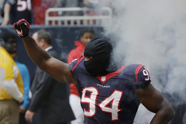Houston Texans' Antonio Smith is introduced before an NFL football game against the New England Patriots,  Sunday, Dec. 1, 2013, in Houston. (AP Photo/David J. Phillip)