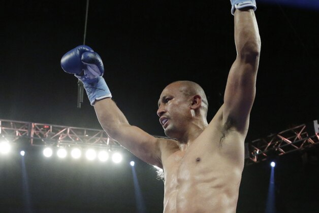 Orlando Salido celebrates his win over Vasyl Lomachenko in a 12-round featherweight title bout on Saturday, March 1, 2014, in San Antonio. Salido won by split decision. (AP Photo/Eric Gay)