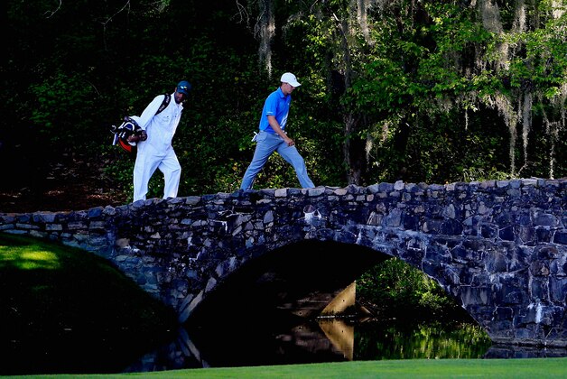 AUGUSTA, GA - APRIL 11:  Jordan Spieth of the United States and his caddie Michael Greller walk over the Nelson Bridge on the 13th hole during the third round of the 2015 Masters Tournament at Augusta National Golf Club on April 11, 2015 in Augusta, Georgia.  (Photo by Jamie Squire/Getty Images)