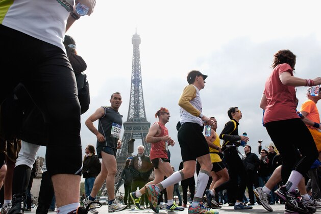 PARIS, FRANCE - APRIL 15:  Competitors run during the 36th Paris Marathon  on April 15, 2012 in Paris, France.  (Photo by Trago/Getty Images)