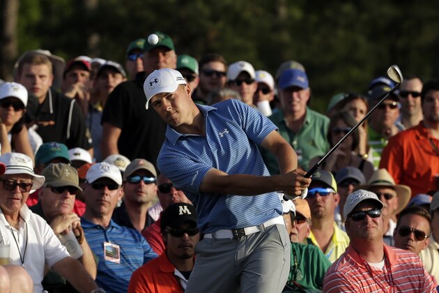 Jordan Spieth hits out of the gallery on the 18th hole during the third round of the Masters golf tournament Saturday, April 11, 2015, in Augusta, Ga. (AP Photo/Chris Carlson)
