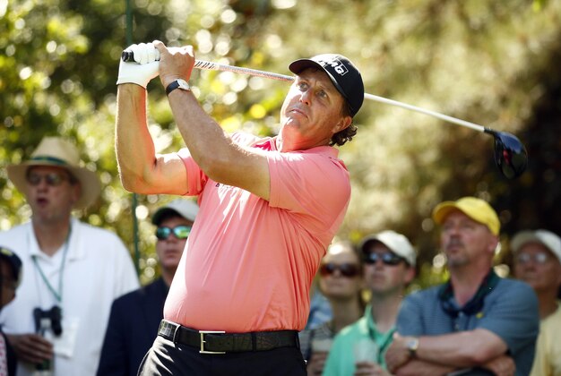 Apr 11, 2015; Augusta, GA, USA; Phil Mickelson hits his tee shot on the 7th hole during the third round of The Masters golf tournament at Augusta National Golf Club. Mandatory Credit: Rob Schumacher-USA TODAY Sports