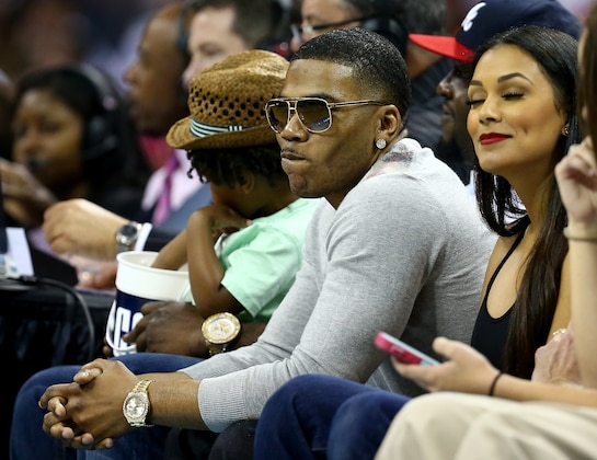 CHARLOTTE, NC - APRIL 28:  Music artist Nelly sits courtside for the Charlotte Bobcats versus Miami Heat in Game Four of the Eastern Conference Quarterfinals during the 2014 NBA Playoffs at Time Warner Cable Arena on April 28, 2014 in Charlotte, North Carolina. NOTE TO USER: User expressly acknowledges and agrees that, by downloading and or using this photograph, User is consenting to the terms and conditions of the Getty Images License Agreement.  (Photo by Streeter Lecka/Getty Images)
