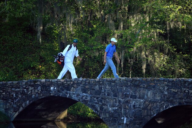 AUGUSTA, GA - APRIL 11:  Jordan Spieth of the United States and his caddie Michael Greller walk over the Nelson Bridge on the 13th hole during the third round of the 2015 Masters Tournament at Augusta National Golf Club on April 11, 2015 in Augusta, Georgia.  (Photo by David Cannon/Getty Images)