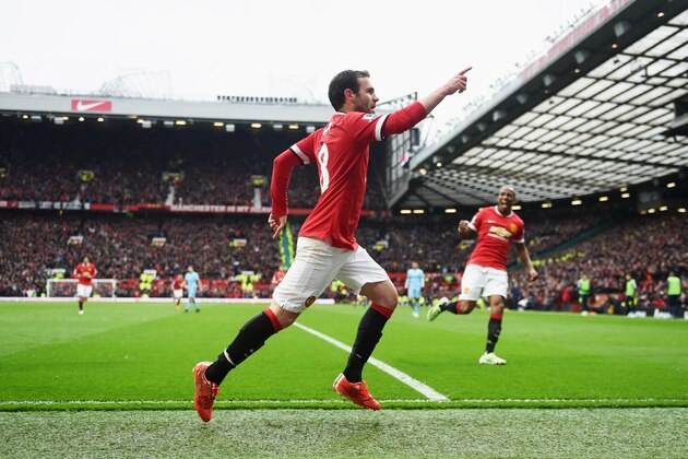 MANCHESTER, ENGLAND - APRIL 12:  Juan Mata of Manchester United celebrates as scores their third goal during the Barclays Premier League match between Manchester United and Manchester City at Old Trafford on April 12, 2015 in Manchester, England.  (Photo by Michael Regan/Getty Images)