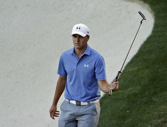 Jordan Spieth acknowledges applause after a birdie on the 13th green during the third round of the Masters golf tournament Saturday, April 11, 2015, in Augusta, Ga. (AP Photo/Charlie Riedel)