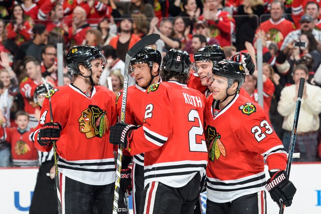 CHICAGO, IL - APRIL 05:  (L-R) Niklas Hjalmarsson #4, Marian Hossa #81, Duncan Keith #2, Jonathan Toews #19 and Kris Versteeg #23 of the Chicago Blackhawks celebrate after Versteeg scored against the St. Louis Blues in the first period during the NHL game at the United Center on April 5, 2015 in Chicago, Illinois.  (Photo by Bill Smith/NHLI via Getty Images)