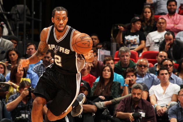 MIAMI, FL - MARCH 31:  Kawhi Leonard #2 of the San Antonio Spurs handles the ball against the Miami Heat on March 31, 2015 at American Airlines Arena in Miami, Florida.  NOTE TO USER: User expressly acknowledges and agrees that, by downloading and or using this Photograph, user is consenting to the terms and conditions of the Getty Images License Agreement. Mandatory Copyright Notice: Copyright 2015 NBAE (Photo by Issac Baldizon/NBAE via Getty Images)