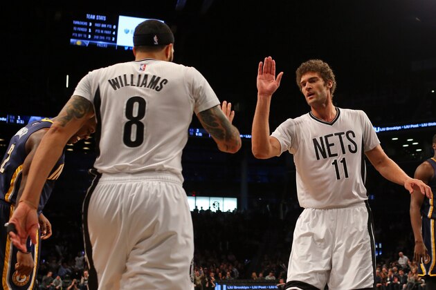 Mar 31, 2015; Brooklyn, NY, USA; Brooklyn Nets center Brook Lopez (11) high-fives guard Deron Williams (8) against the Indiana Pacers during the first half at Barclays Center. Mandatory Credit: Adam Hunger-USA TODAY Sports