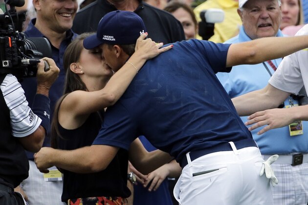 Jordan Spieth kisses his girlfriend Annie after winning the Masters golf tournament Sunday, April 12, 2015, in Augusta, Ga. (AP Photo/David J. Phillip)