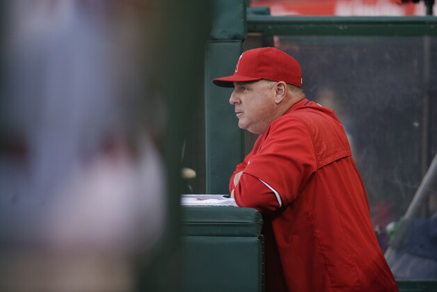 Los Angeles Angels manager Mike Scioscia watches from the dugout during the first inning of a baseball game against the Kansas City Royals, Saturday, April 11, 2015, in Anaheim, Calif. (AP Photo/Jae C. Hong)