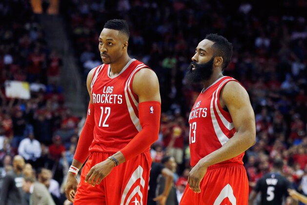 HOUSTON, TX - MARCH 27:  James Harden #13 and Dwight Howard #12 of the Houston Rockets walk off the court during their game against the Minnesota Timberwolves at the Toyota Center on March 27, 2015 in Houston, Texas. NOTE TO USER: User expressly acknowledges and agrees that, by downloading and/or using this photograph, user is consenting to the terms and conditions of the Getty Images License Agreement.  (Photo by Scott Halleran/Getty Images)