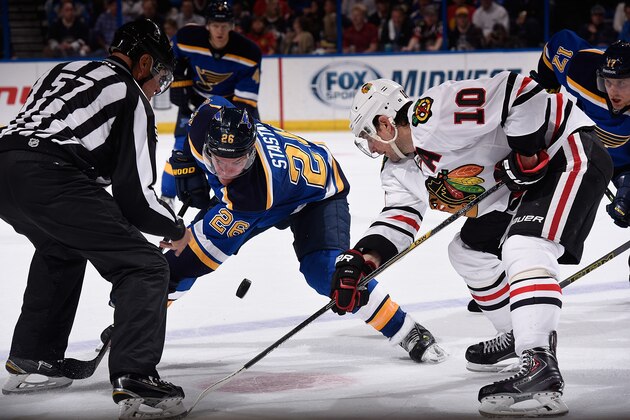 ST. LOUIS, MO - APRIL 9: Paul Stastny #26 of the St. Louis Blues faces off against Patrick Sharp #10 of the Chicago Blackhawks on April 9, 2015 at the Scottrade Center in St. Louis, Missouri. (Photo by Scott Rovak/NHLI via Getty Images)