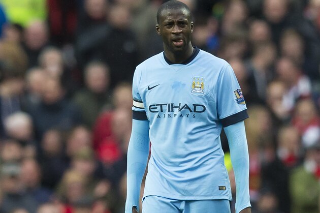 Manchester City's Yaya Toure waits for play to resume after Manchester United's third goal during the English Premier League soccer match between Manchester United and Manchester City at Old Trafford Stadium, Manchester, England, Sunday, April 12, 2015. (AP Photo/Jon Super)