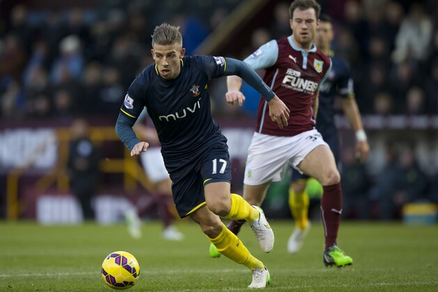 Southampton's Toby Alderweireld, left, keep the ball from Burnley's Ashley Barnes during the English Premier League soccer match between Burnley and Southampton at Turf Moor Stadium, Burnley, England, Saturday, Dec. 13, 2014. (AP Photo/Jon Super)