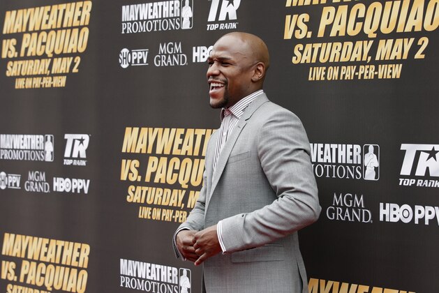 Boxer Floyd Mayweather Jr. arrives for a news conference, Wednesday, March 11, 2015, in Los Angeles. Mayweather is scheduled to fight Manny Pacquiao, of the Philippines, in Las Vegas on May 2. (AP Photo/Jae C. Hong)