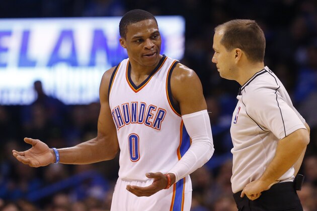 Oklahoma City Thunder guard Russell Westbrook (0) disputes a technical foul call with official John Goble, right, in the third quarter of an NBA basketball game in Oklahoma City, Tuesday, Feb. 24, 2015. Oklahoma City won 105-92. (AP Photo/Sue Ogrocki)