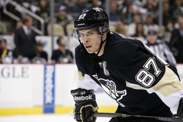 Pittsburgh Penguins center Sidney Crosby (87) prepares to take a face-off during the second period of an NHL hockey game against the New York Islanders in Pittsburgh Friday, April 10, 2015. The Islanders won 3-1.(AP Photo/Gene J. Puskar)