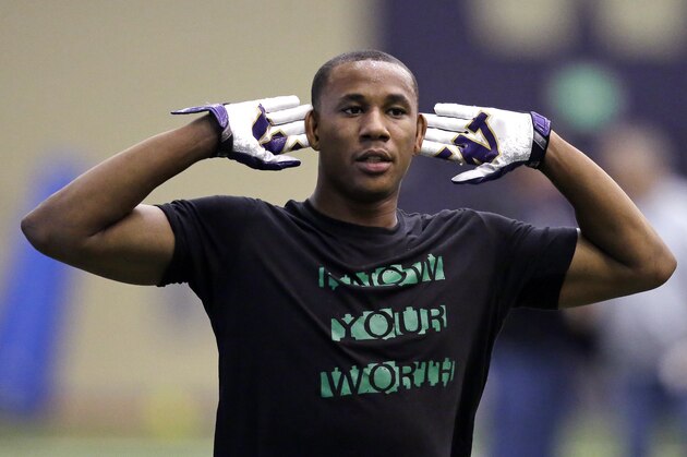 Former Washington player Marcus Peters motions as he works out at Washington's pro day Thursday, April 2, 2015, in Seattle.  (AP Photo/Elaine Thompson)
