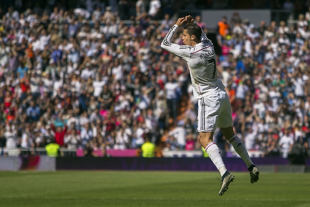 Real Madrid's Cristiano Ronaldo, right, celebrates his goal  during a Spanish La Liga soccer match between Real Madrid vs Eibar at the Santiago Bernabeu stadium in Madrid, Spain, Saturday, April 11, 2015. (AP Photo/Andres Kudacki)
