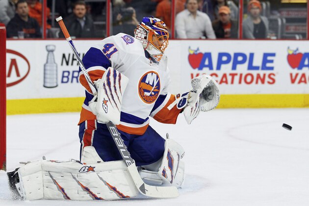 New York Islanders' Jaroslav Halak eyes the puck coming at him as he defends the net in the second period of an NHL hockey game against the Philadelphia Flyers, Tuesday, April 7, 2015, in Philadelphia. The Flyers won 5-4. (AP Photo/Tom Mihalek)