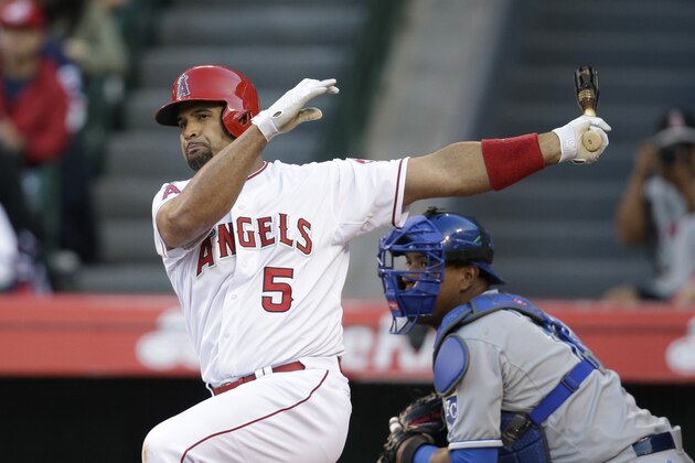 Los Angeles Angels' Albert Pujols hits a ground ball during the first inning of a baseball game against the Kansas City Royals, Saturday, April 11, 2015, in Anaheim, Calif. (AP Photo/Jae C. Hong)