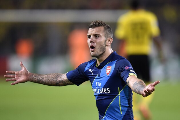 Arsenal's Jack Wilshere gestures during the Champions League group D soccer match between Borussia Dortmund and Arsenal in Dortmund, Germany, Tuesday, Sept.16,2014. (AP Photo/Martin Meissner)