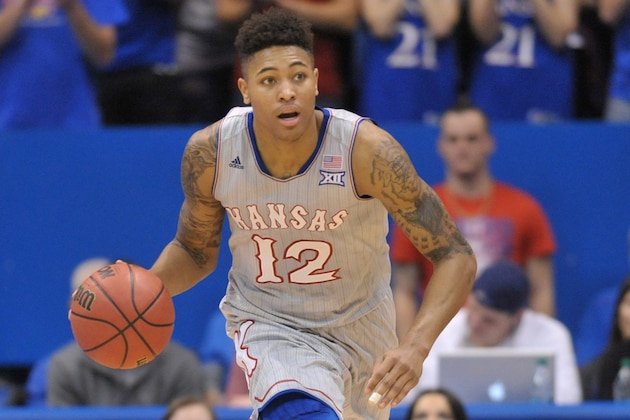 Dec 30, 2014; Lawrence, KS, USA; Kansas Jayhawks guard Kelly Oubre Jr. (12) dribbles the ball during the second half against the Kent State Golden Flashes at Allen Fieldhouse. Kansas won 78-62. Mandatory Credit: Denny Medley-USA TODAY Sports