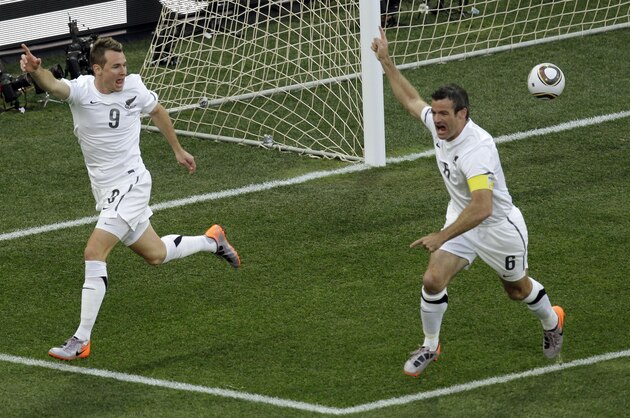 New Zealand's Shane Smeltz, left, celebrates with his teammate Ryan Nelsen  after scoring during the World Cup group F soccer match between Italy and New Zealand at Mbombela Stadium in Nelspruit, South Africa, Sunday, June 20, 2010.  (AP Photo/Michael Sohn)