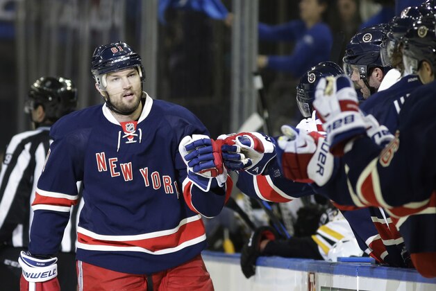 New York Rangers left wing Rick Nash (61) greets his teammates after scoring in the first period of an NHL hockey game Boston Bruins at Madison Square Garden in New York, Wednesday, Feb. 4, 2015. (AP Photo/Kathy Willens)