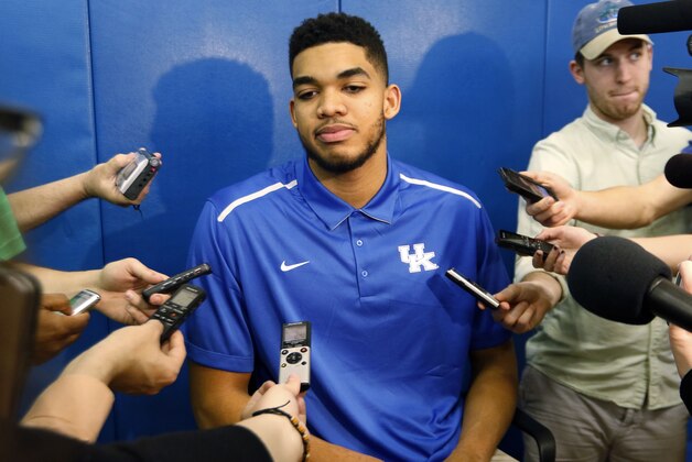 Kentucky NCAA college basketball player Karl-Anthony Towns listens to a reporters question after announcing his intent to place his name in the NBA draft during a news conference at the Joe Craft Center, Thursday, April 9, 2015, in Lexington, Ky. (AP Photo/James Crisp)