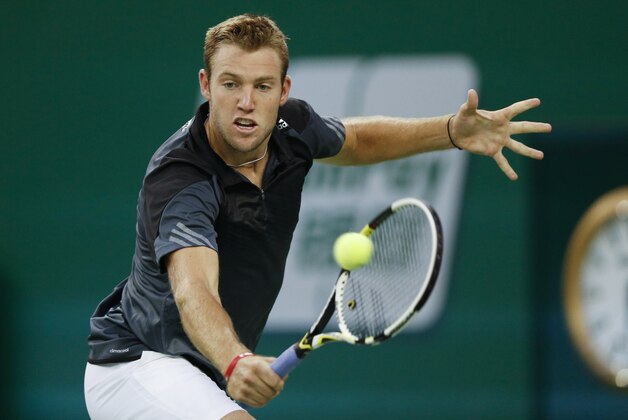 Jack Sock of the US returns a shot during their men's singles second round match against Kei Nishikori of Japan at the Shanghai Masters Tennis Tournament in Shanghai, China, Wednesday, Oct. 8, 2014.  (AP Photo/Vincent Thian)