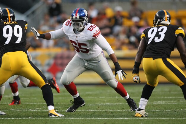 Aug 10, 2013; Pittsburgh, PA, USA; New York Giants tackle Will Beatty (65) blocks against the Pittsburgh Steelers during the first half at Heinz Field. Mandatory Credit: Jason Bridge-USA TODAY Sports