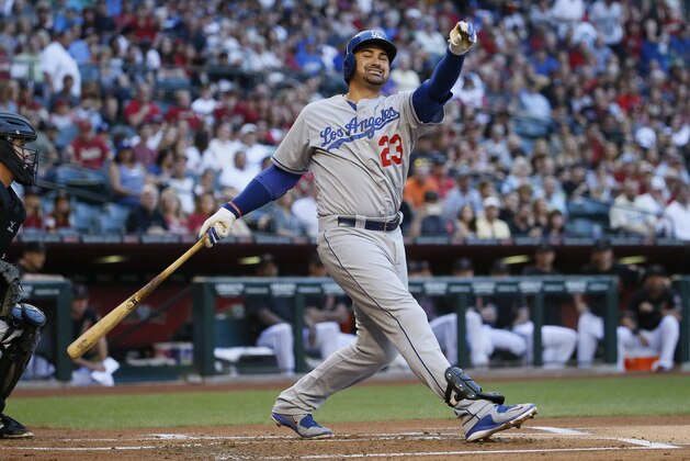 Los Angeles Dodgers Adrian Gonzalez strikes out against the Arizona Diamondbacks during the first inning of a baseball game, Saturday, April 11, 2015, in Phoenix. (AP Photo/Matt York)