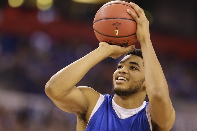 Kentucky's Karl-Anthony Towns shoots during a practice session for the NCAA Final Four tournament college basketball semifinal game Friday, April 3, 2015, in Indianapolis. Kentucky plays Wisconsin on Saturday. (AP Photo/Michael Conroy)