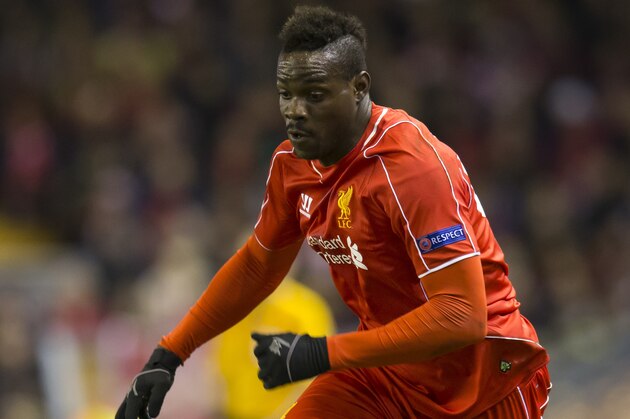 Liverpool's Mario Balotelli takes the ball downfield during the Europa League Round of 32 soccer match between Liverpool and Besiktas at Anfield Stadium in Liverpool, England, Thursday, Feb. 19, 2015. (AP Photo/Jon Super)