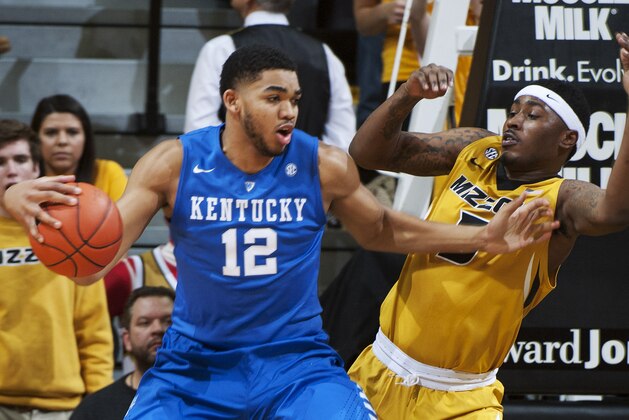 Kentucky's Karl-Anthony Towns, left, pushes past Missouri's D'Angelo Allen on a drive to the basket during the first half of an NCAA college basketball game Thursday, Jan. 29, 2015, in Columbia, Mo. (AP Photo/L.G. Patterson)