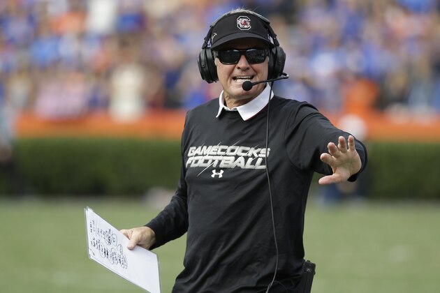 South Carolina head coach Steve Spurrier motions to his bench during a timeout in the second half of an NCAA college football game against Florida in Gainesville, Fla., Saturday, Nov. 15, 2014. South Carolina won in overtime 23-20. (AP Photo/John Raoux)