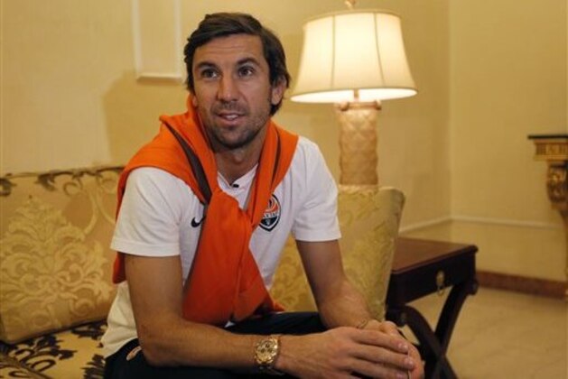 In this photo taken on Friday, Feb. 13, 2015, player of FC Shakhtar  Donetsk Darijo Srna speaks to the Associated Press in Kiev, Ukraine. More than a year ago, Shakhtar Donetsk was poised to become one of European soccer’s giants. Backed by Ukraine’s richest man, industrialist Rinat Akhmetov, the club imported Brazilian stars en masse with a mission to win the Champions League, Europe’s most prestigious competition. Now, with the country wracked by conflict, Shakhtar has become a team of multimillionaire refugees. (AP Photo/Sergei Chuzavkov)