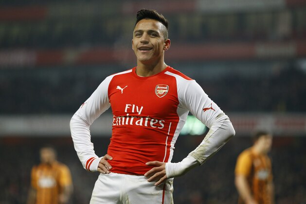 Arsenal's Alexis Sanchez smiles after a missed opportunity during the English FA Cup third round soccer match between Arsenal and Hull City at the Emirates Stadium in London, Sunday, Jan. 4, 2015. (AP Photo/Kirsty Wigglesworth)