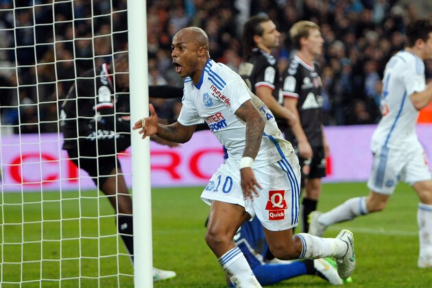 Marseille's Ghanaian forward Andre Ayew celebrates after scoring against Reims, during the League One soccer match between Marseille and Reims, at the Velodrome Stadium, in Marseille, southern France, Friday, Feb. 13, 2015. (AP Photo/Claude Paris)