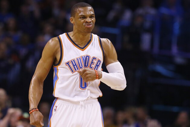 Oklahoma City Thunder guard Russell Westbrook reacts after hitting three point shot in the first quarter of an NBA basketball game against the Portland Trail Blazers in Oklahoma City, Monday, April 13, 2015. (AP Photo/Sue Ogrocki)