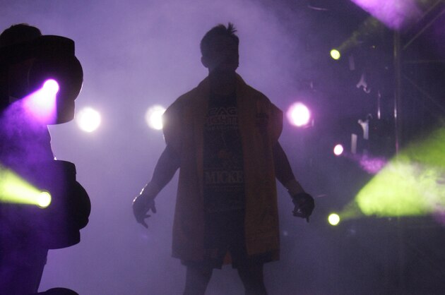 Cung Le walks to the cage to face Frank Shamrock in their Strikeforce middleweight championship mixed martial arts fight on Saturday, March 29, 2008, in San Jose, Calif. Le won the title by TKO after Shamrock did not answer the bell in the fourth round. (AP Photo/Jeff Chiu)