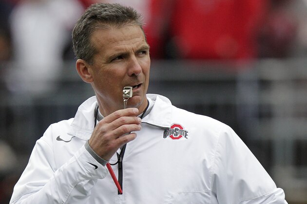 Ohio State's Urban Meyer watches warm ups before the start of their spring NCAA college football game Saturday, April 21, 2012, in Columbus, Ohio. (AP Photo/Jay LaPrete)
