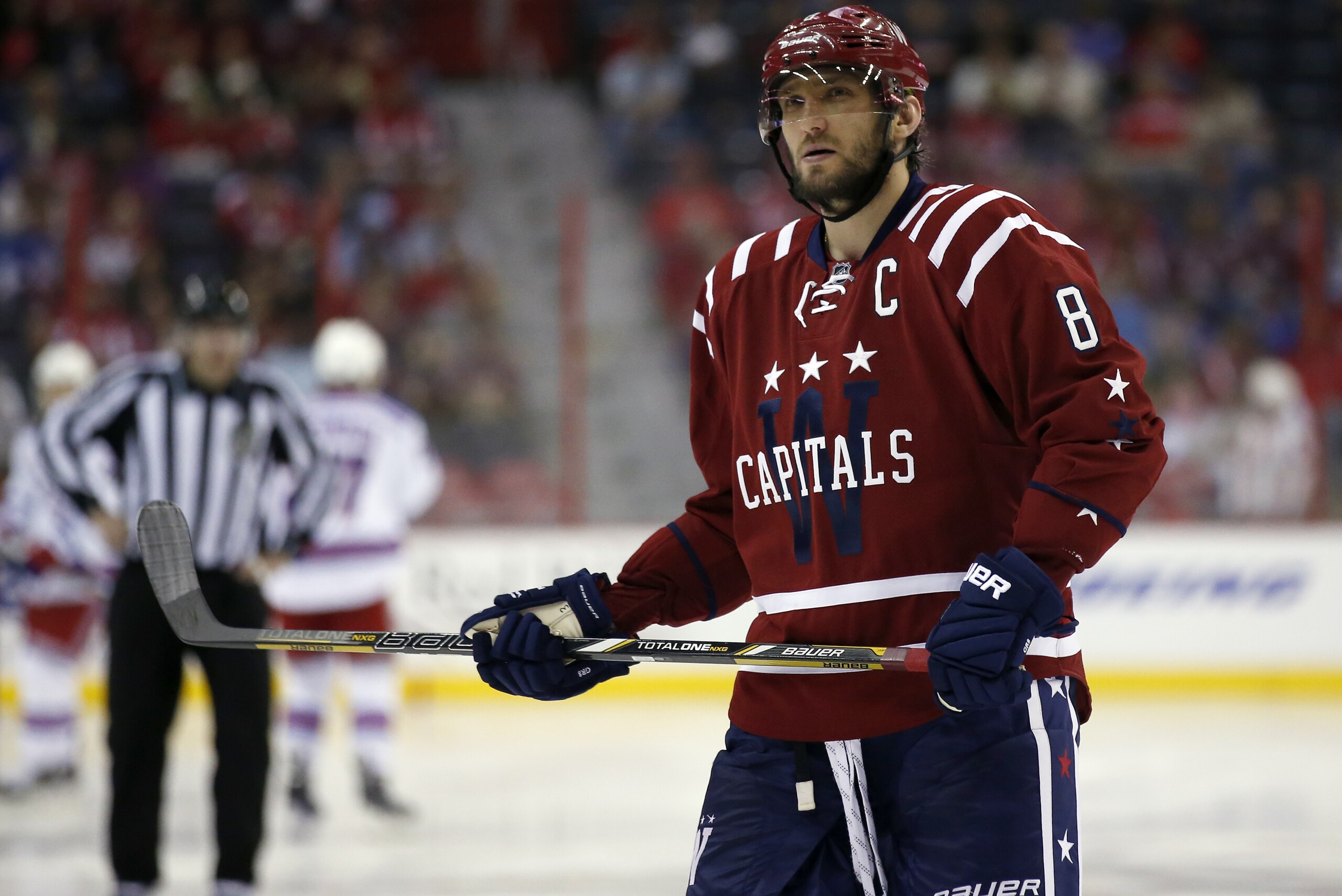 Washington Capitals left wing Alex Ovechkin (8), from Russia, skates on the ice during a break in the second period of an NHL hockey game against the New York Rangers , Saturday, April 11, 2015, in Washington. (AP Photo/Alex Brandon)