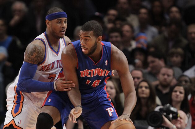 Detroit Pistons center Greg Monroe (10) backs up against New York Knicks forward Carmelo Anthony (7) in the first half of their NBA basketball game at Madison Square Garden in New York, Tuesday, Jan. 31, 2012.  (AP Photo/Kathy Willens)