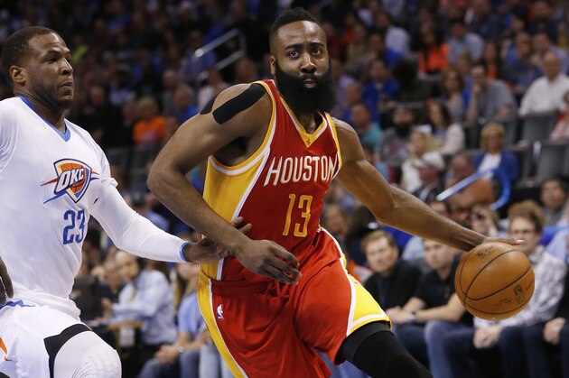Houston Rockets guard James Harden (13) drives around Oklahoma City Thunder guard Dion Waiters (23) during an NBA basketball game between the Houston Rockets and the Oklahoma City Thunder in Oklahoma City, Sunday, April 5, 2015. Houston won 115-112. (AP Photo/Sue Ogrocki)